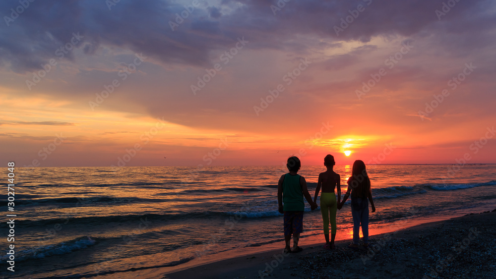 silhouette of kids at sunset