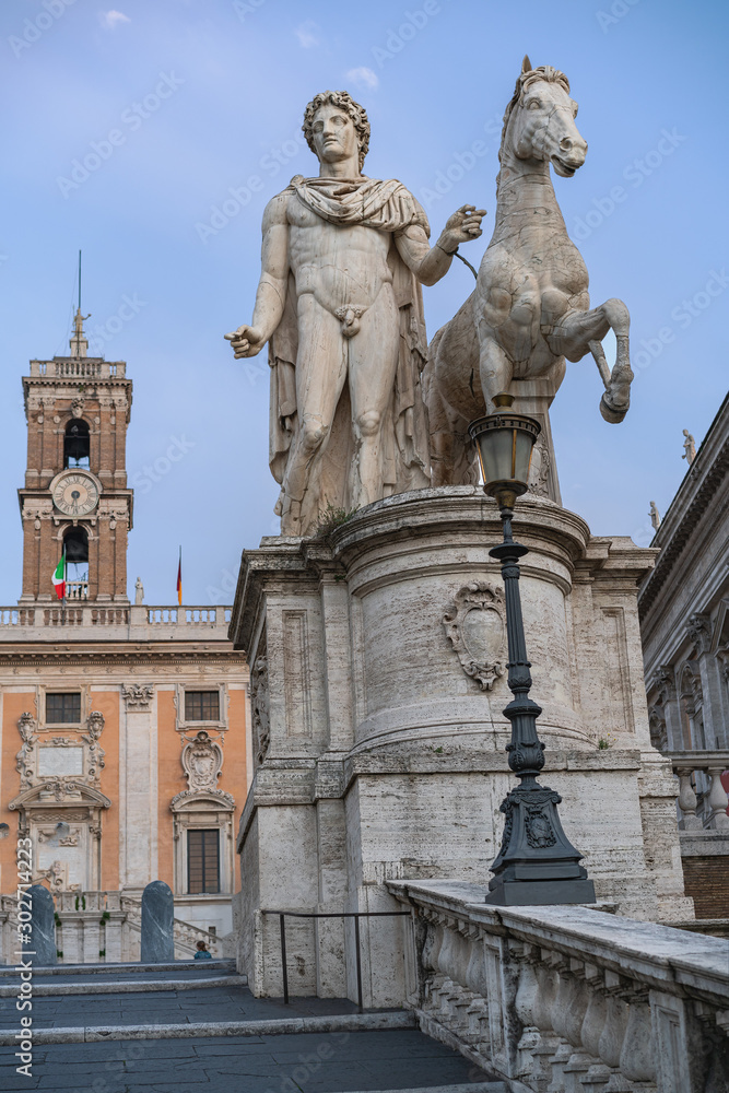 marble sculpture of Dioscorus, patron saint of republican Rome against a blue sky