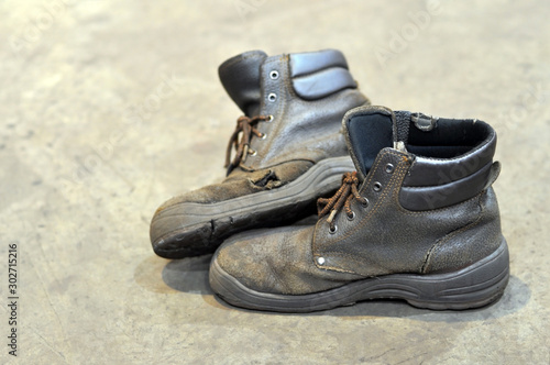 He heavily used work boots on rough terrain.