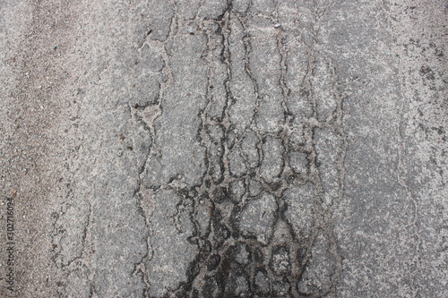 cracked asphalt texture, background. can be used as wallpaper