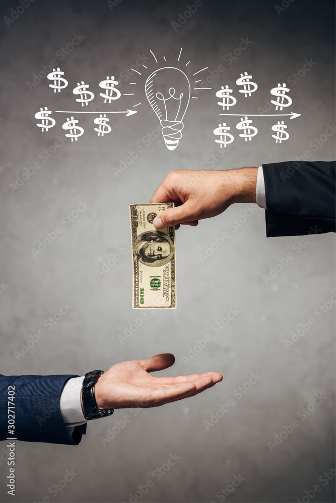 cropped view man giving money to businessman on grey background with light bulb and dollar signs illustration cropped view man giving money to businessman on grey background with light bulb and dollar signs illustration