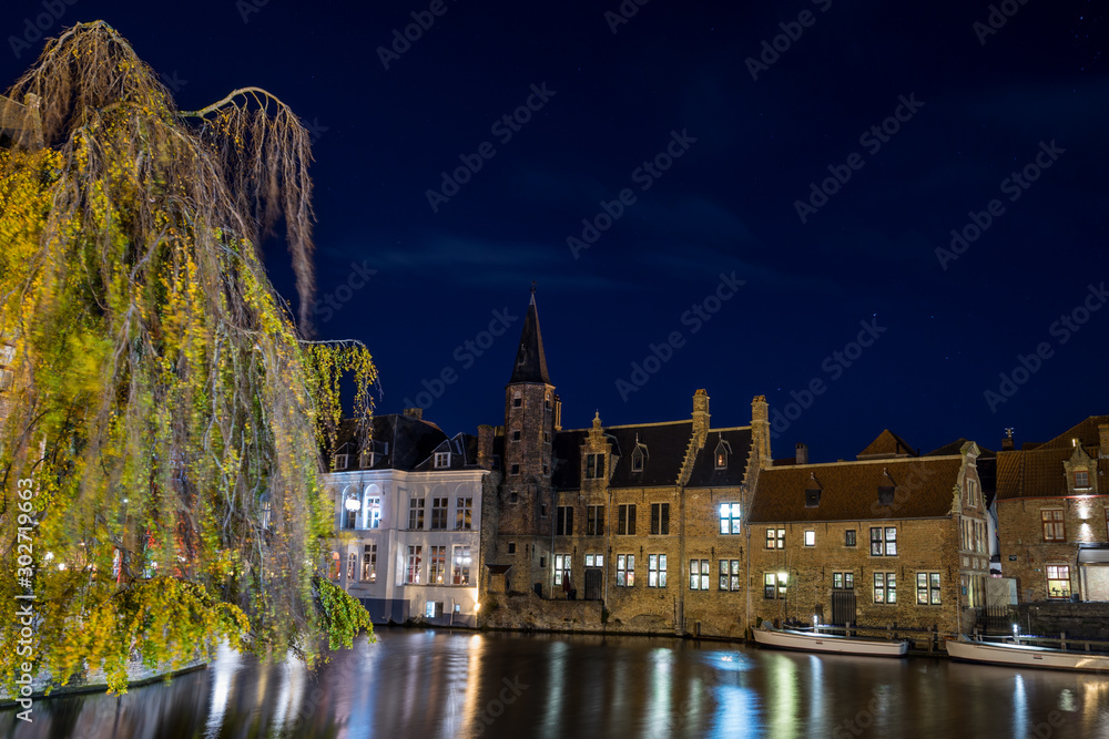 Old buildings in Brugges by night, Belgium.