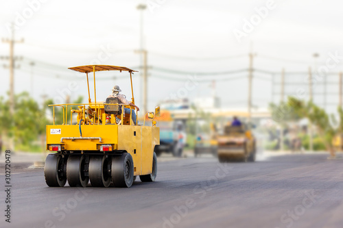 Driver control motor vehicle or heavy roller wheel tires or steamroller for road making or street - highway construction during working at work place