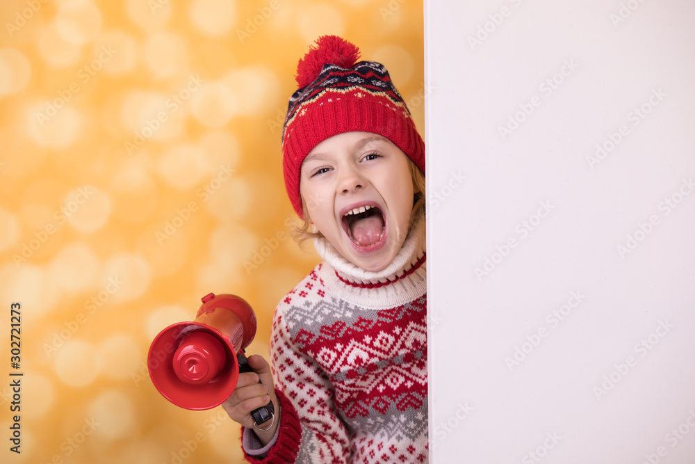 Little girl shouts something into the megaphone