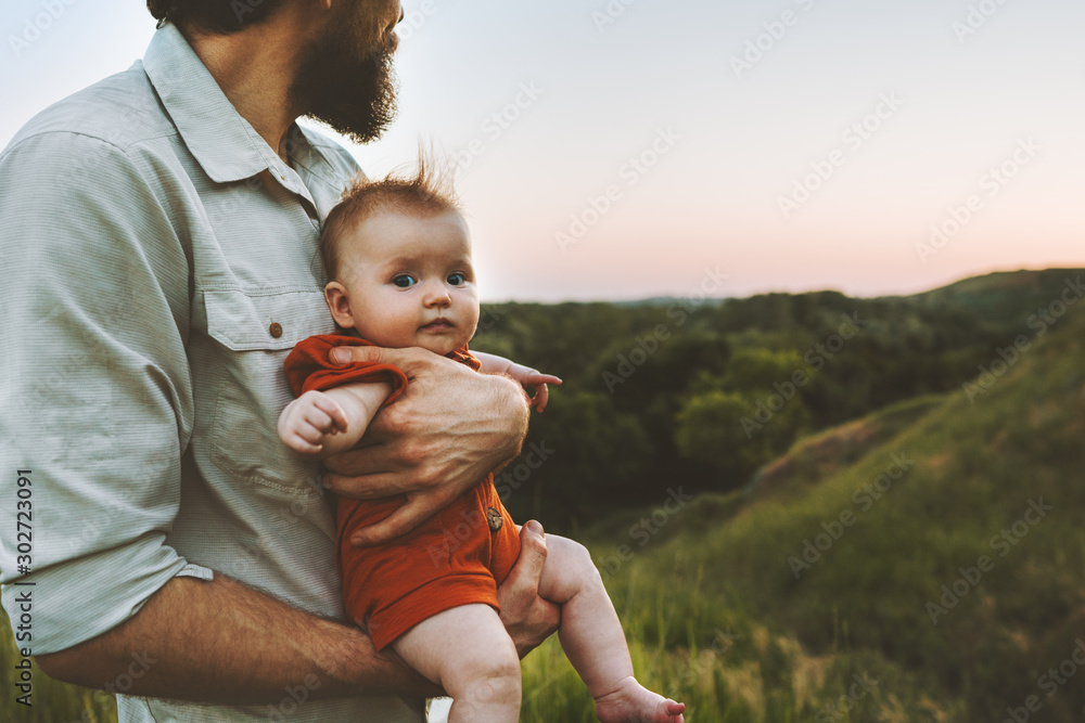 Father walking with baby outdoors family lifestyle dad and child together summer vacations parenthood childhood concept Fathers day holiday - obrazy, fototapety, plakaty 