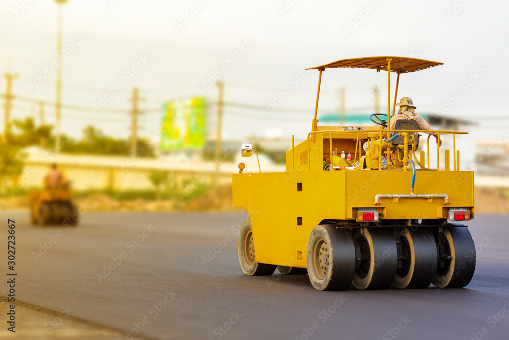Driver control motor vehicle or heavy roller wheel tires or steamroller for road making or street - highway construction during working at work place