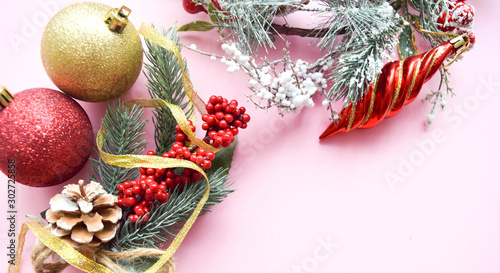 Christmas decoration. Fir tree twig fresh decorated against light background  top view  copy space. Conception Christmas and New Year.