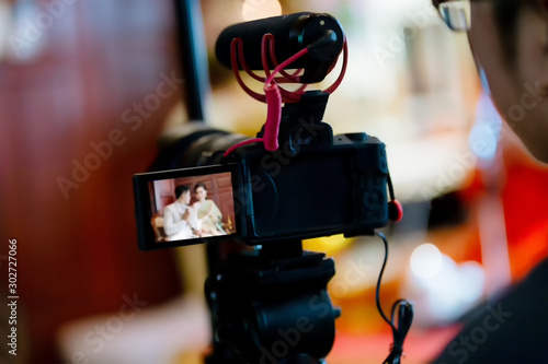 Camera show viewfinder image catch motion in interview or broadcast wedding ceremony, catch feeling, stopped motion in best memorial day concept. Video Cinema From dslr camera.video cinema production  photo