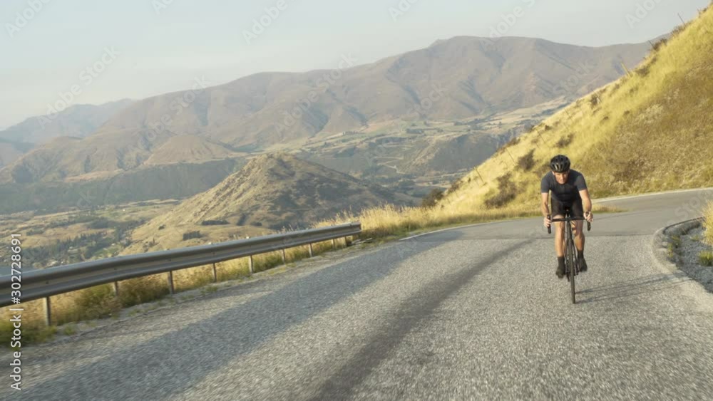 Male on bicycle workout The Remarkables New Zealand Male on bicycle workout The Remarkables New Zealand