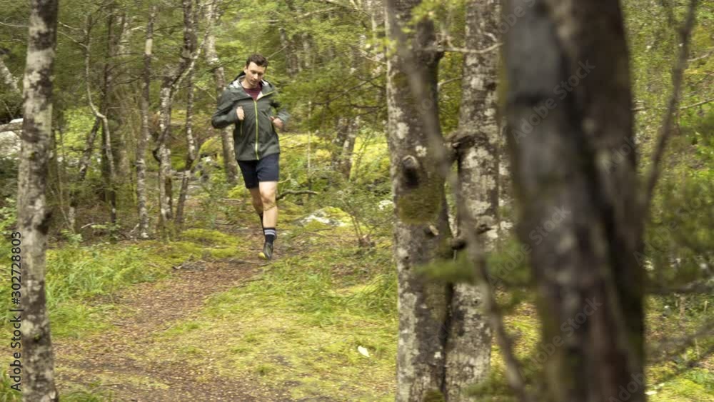 Man runner training running South Island New Zealand Man runner training running South Island New Zealand