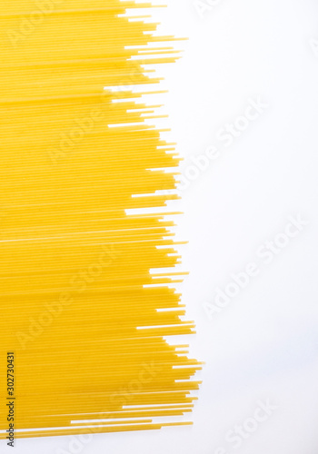 Dry spaghetti on a white background. Italian pasta. A place to copy. Food and healthy eating. Isolated
