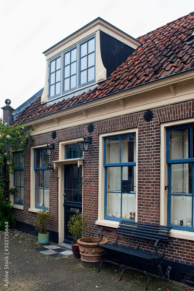 View of historical, traditional and typical house in Edam. It is a town famous for its semi hard cheese in the northwest Netherlands, in the province of North Holland.