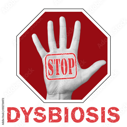 Stop dysbiosis conceptual illustration. Open hand with the text stop dysbiosis. photo