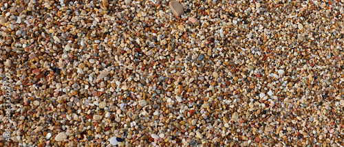 Slika na platnu many very small pebbles and stones
