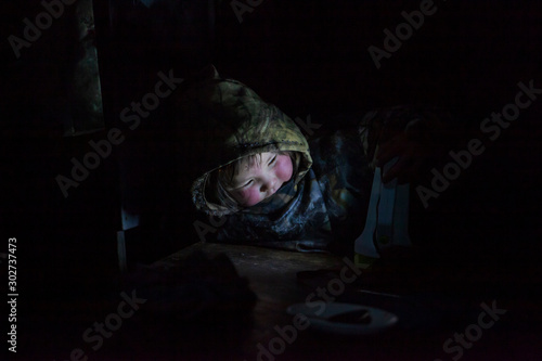children in the plague, A resident of the tundra, indigenous residents of the Far North, tundra, little girl in the yurt, lack of natural light, selective focus;artistic noise,