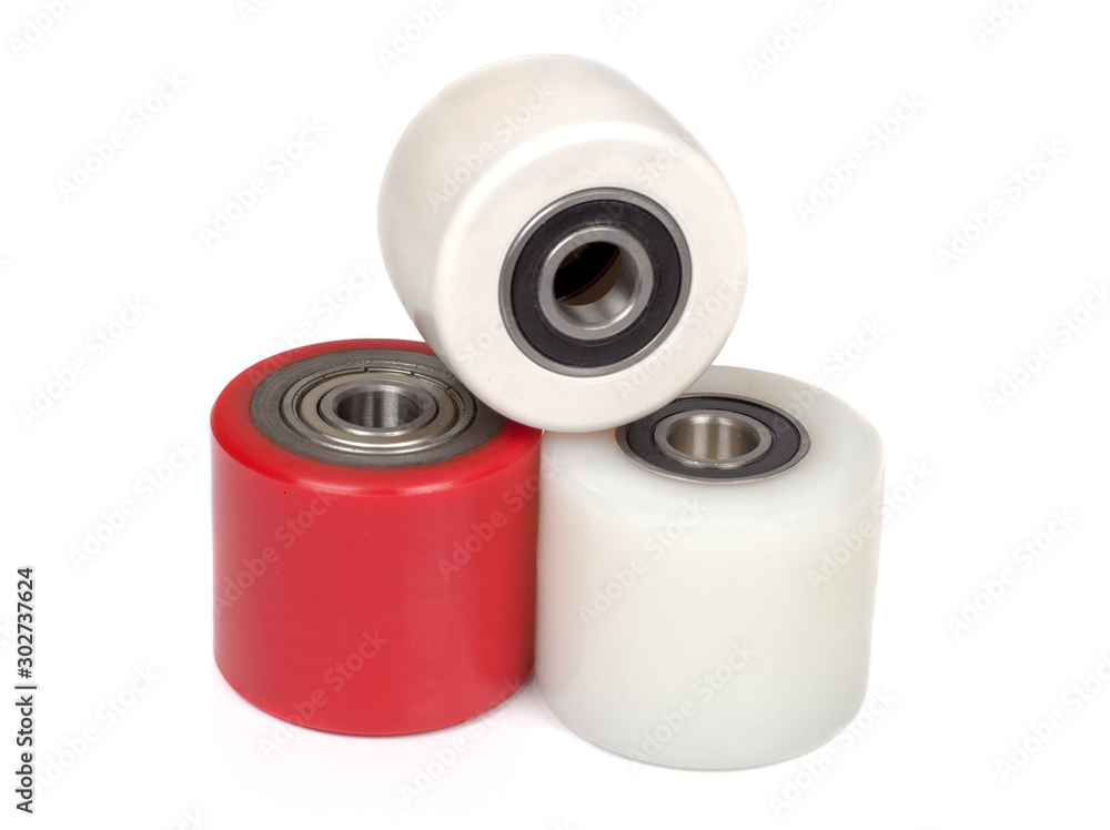 An industrial rollers for hoisting equipment made of polyamide and polyurethane isolated on a white An industrial rollers for hoisting equipment made of polyamide and polyurethane isolated on a white