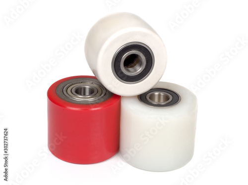 An industrial rollers for hoisting equipment made of polyamide and polyurethane isolated on a white photo