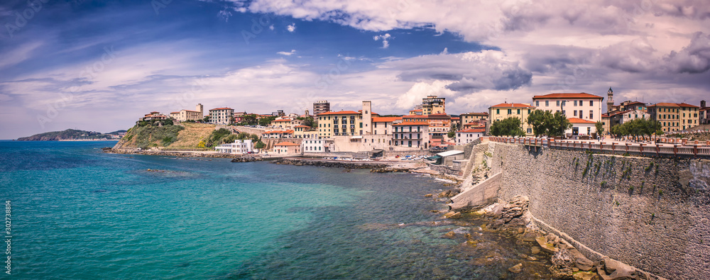 Cloudy Piombino (Tuscany) shore panorama with view towards the old town