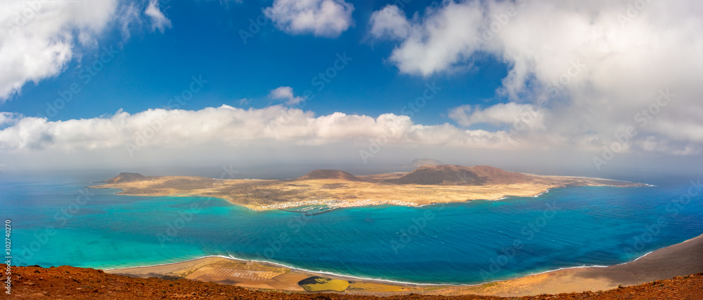Scenery of volcanic Lanzarote - panoramic view from Mirador del Rio for island Graciosa. Canary islands