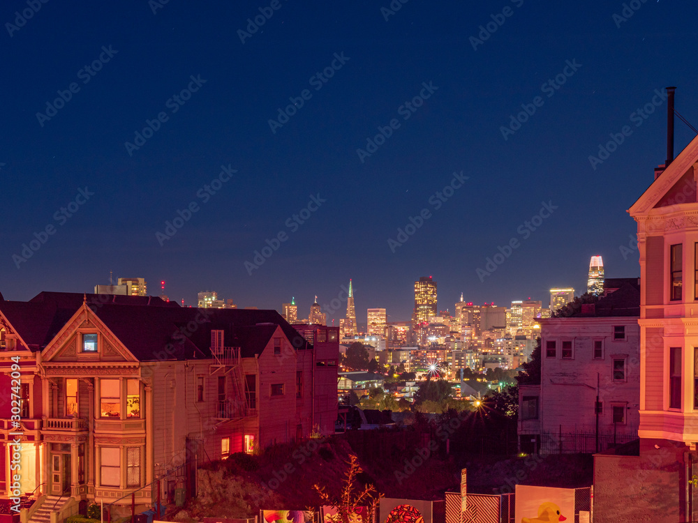 Painted Ladies with San Francisco Skyline at the background during night