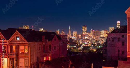 Painted Ladies with San Francisco Skyline at the background during night