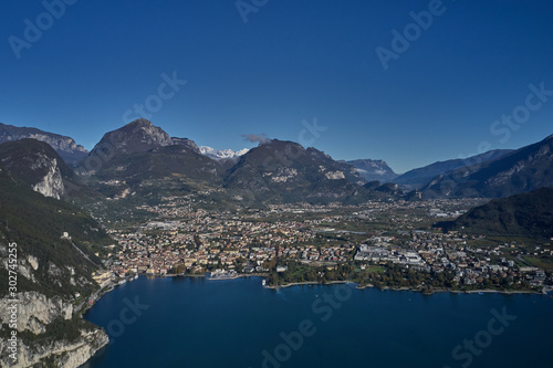 Rock in the background the city of Riva del Garda, Italy. Autumn season. Aerial view