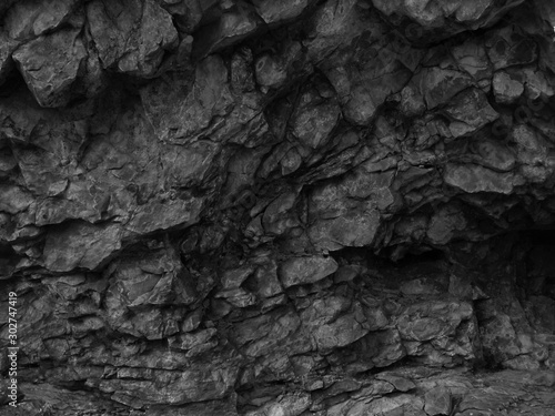 Black stone grunge texture. Dark gray rock background. Mountain close-up. Black rock backdrop. © Наталья Босяк