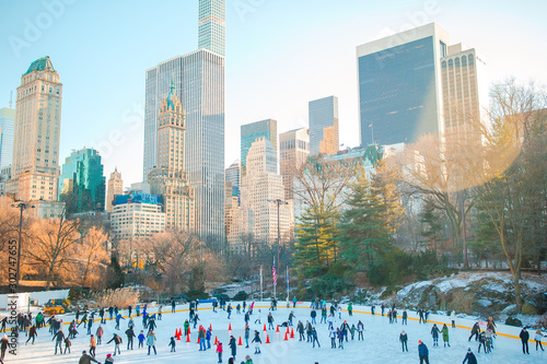 Ice skaters having fun in New York Central Park in winter