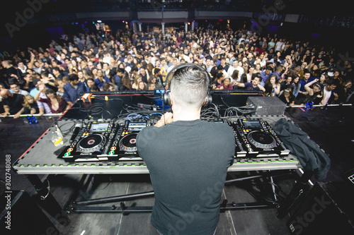 Nightclub DJ Facing Large Crowd
