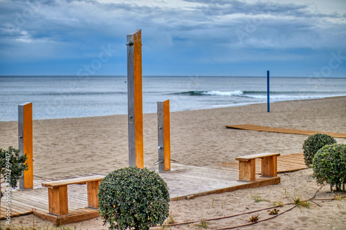 Shower on the beach to clean the sand and salt after bathing photo