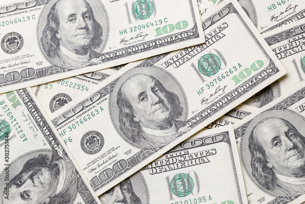 Texture of dollar bills. One hundred dollars. Texture of dollar bills. One hundred dollars.