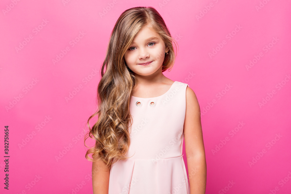girl in a pink dress on a pink background in the studio girl in a pink dress on a pink background in the studio