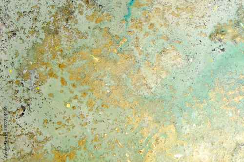Acrylic artwork with golden stains. Abstract modern art on canvas. Grunge effect.