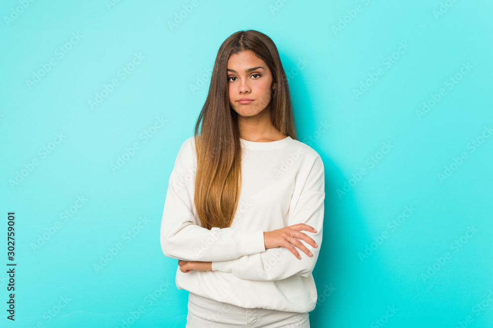 Young slim woman unhappy looking in camera with sarcastic expression. Young slim woman unhappy looking in camera with sarcastic expression.
