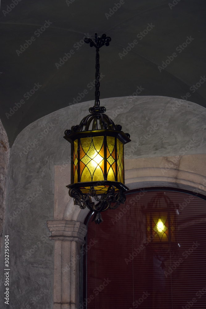 Suspended Black Iron Lantern with Reflection in Old Dark Arcade 3586-039 Suspended Black Iron Lantern with Reflection in Old Dark Arcade 3586-039