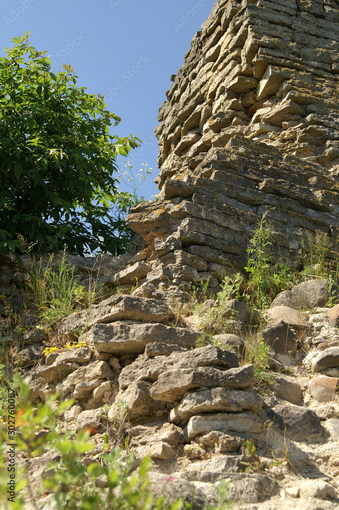 the ruined stone wall of the old fortress