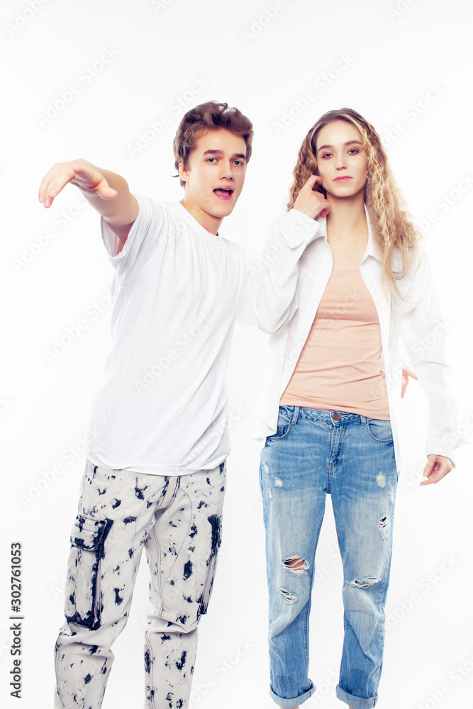 young pretty couple together posing cheerful isolated on white background, lifestyle people concept, happy boy and girl young pretty couple together posing cheerful isolated on white background, lifestyle people concept, happy boy and girl