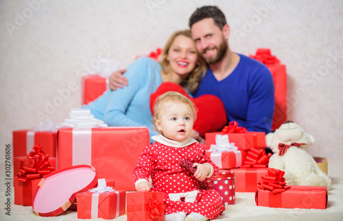 father, mother and doughter child. Love and trust in family. Bearded man and woman with little girl. Happy family with gift box. Shopping online. Boxing day. Valentines day. Love is a great feeling