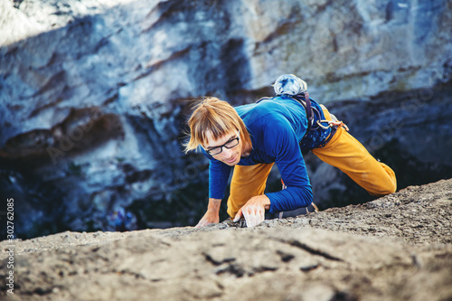 Man climbing a rock.