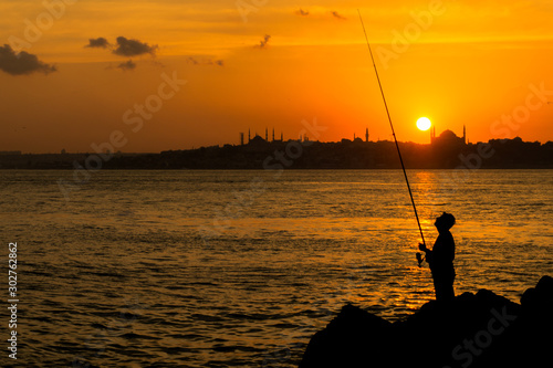 fisherman in the sunset