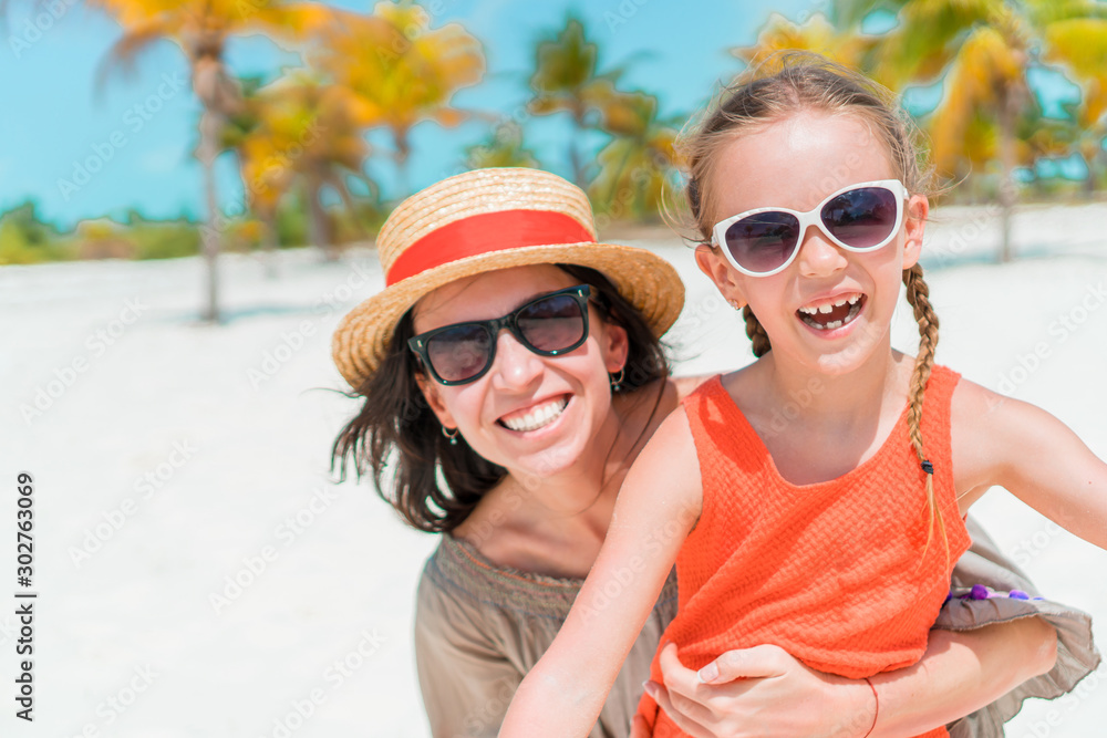 Portrait of little girl and mother on summer vacation