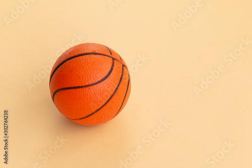 Basketball symbol isolated on yellow background with space for text