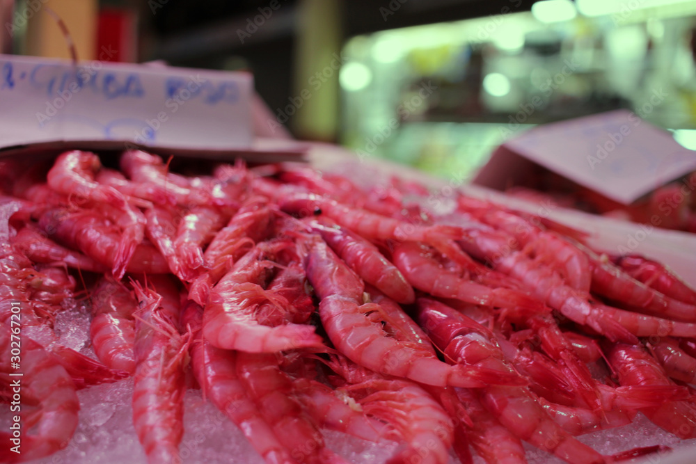 Close-up of a box of fresh prawns at a fish market stall in the market Close-up of a box of fresh prawns at a fish market stall in the market