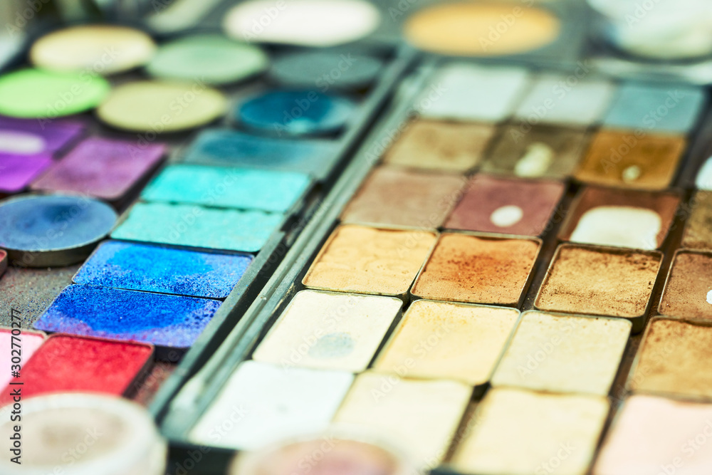 Various makeup products on dark background with copyspace. Beauty and fashion concept Various makeup products on dark background with copyspace. Beauty and fashion concept