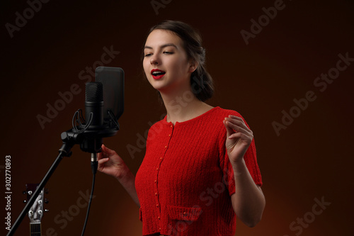 Obraz na plátně Recording the vocal part in the recording Studio