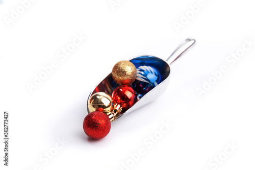 a bakery scoop of christmas ornaments isolated on white