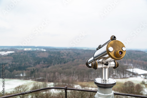 Binocular on observation deck on hill in winter