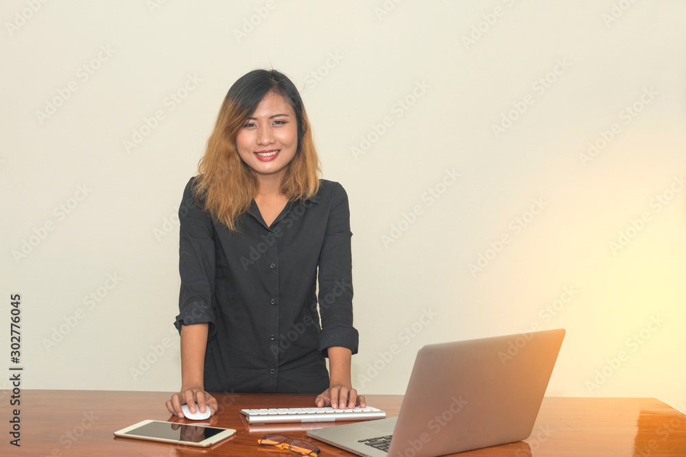 Business woman Is working on a laptop in the office. Business woman Is working on a laptop in the office.