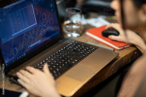 a woman working with laptop