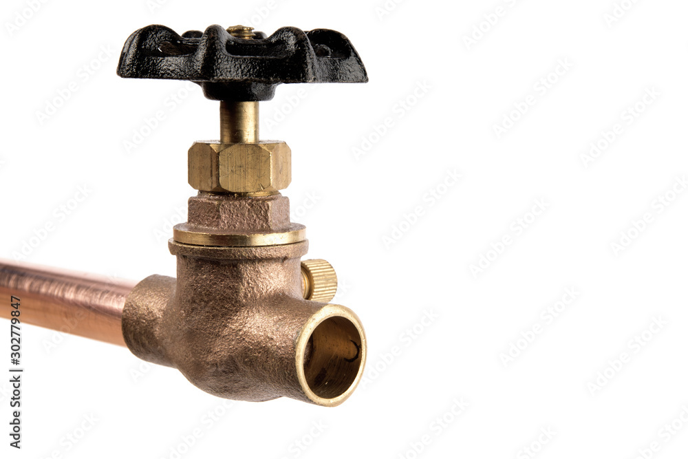 extreme macro closeup of a brass plumbing valve on a copper pipe isolated on white extreme macro closeup of a brass plumbing valve on a copper pipe isolated on white
